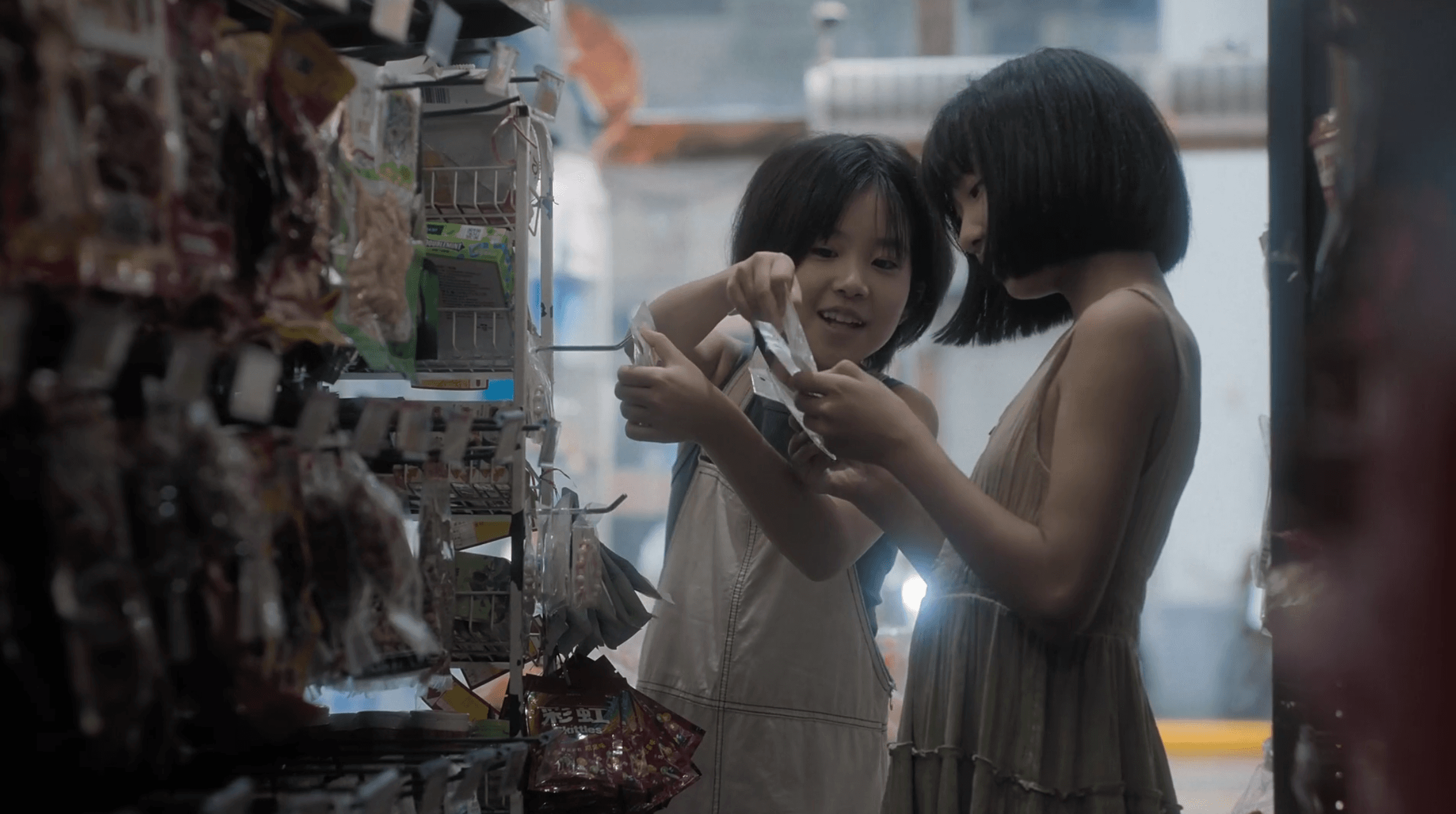 Three children sharing a happy moment in a neighborhood shop