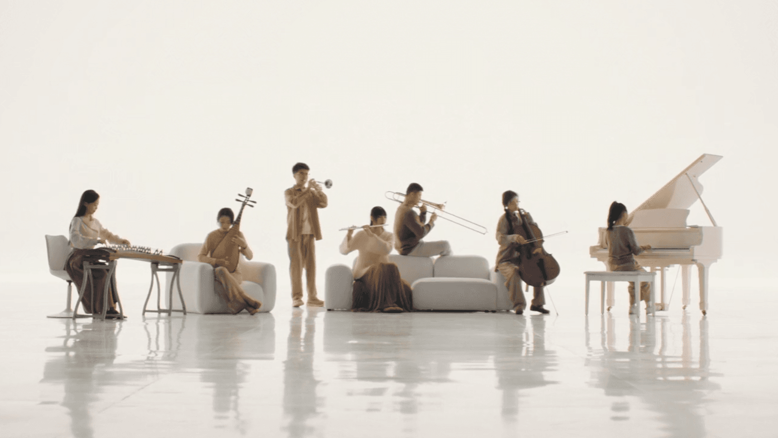 A group of musicians performing together in a bright white studio